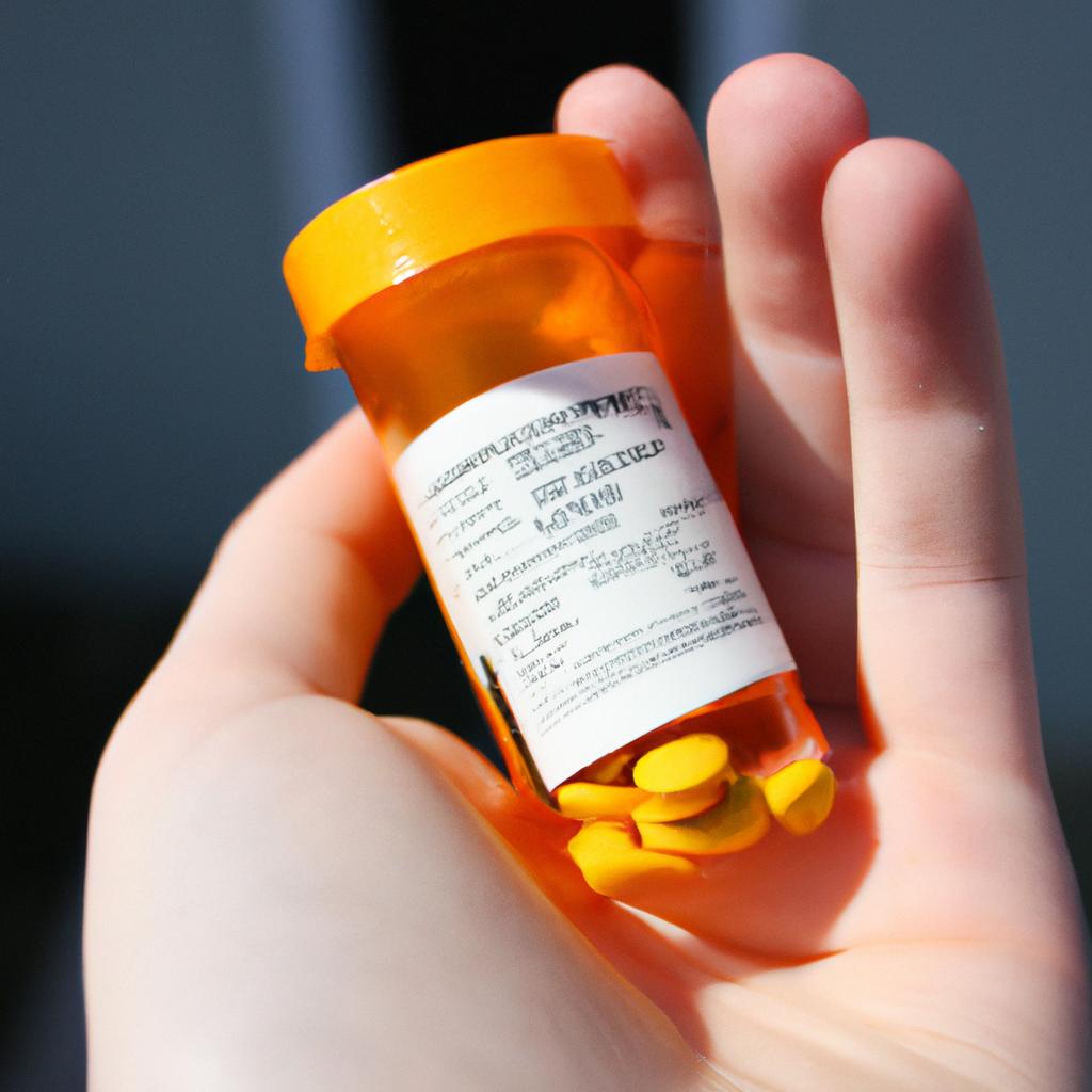 Person holding prescription pill bottle